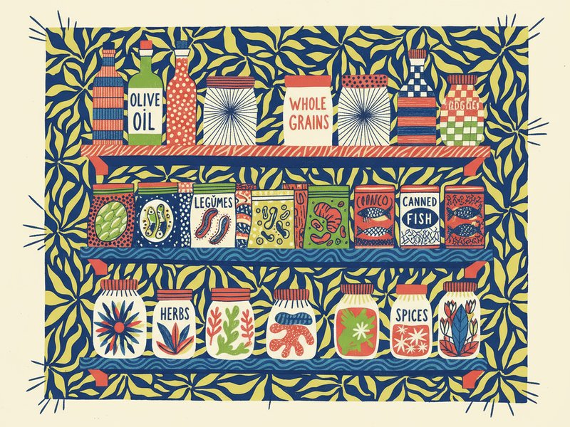 Shelves stocked with olive oil, whole grains, canned fish, legumes, herbs, and spices